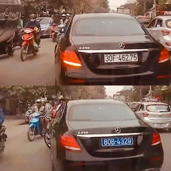 Chiếc xe dùng bảng số đổi từ trắng sang xanh bị người đi đường tình cờ quay lại clip. (Hình cắt từ video clip-Facebook)